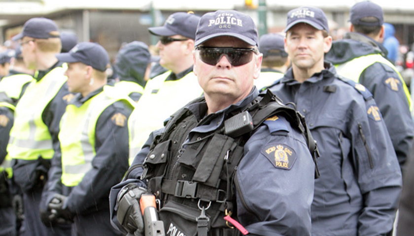 Royal Canadian Mounted Police in riot gear